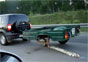 Video: SUV Gets Tree Trunk Spare Tire
