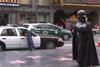 Man Robs Police Car. Darth Vader And Superman Watch Helplessly