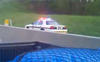 Police Car Drives Backwards Into Incoming Highway Traffic