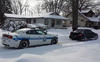 Subaru WRX STI Pulls Stuck Police Car Out Of Snow