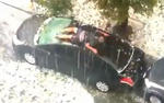 Guy Protects Car From Hail With Own Body