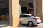 Kia Cerato Crashes Ferrari Dealership