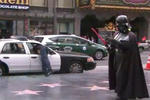 Man Robs Police Car. Darth Vader And Superman Watch Helplessly