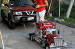 Toy Truck Pulls Full Size Nissan SUV